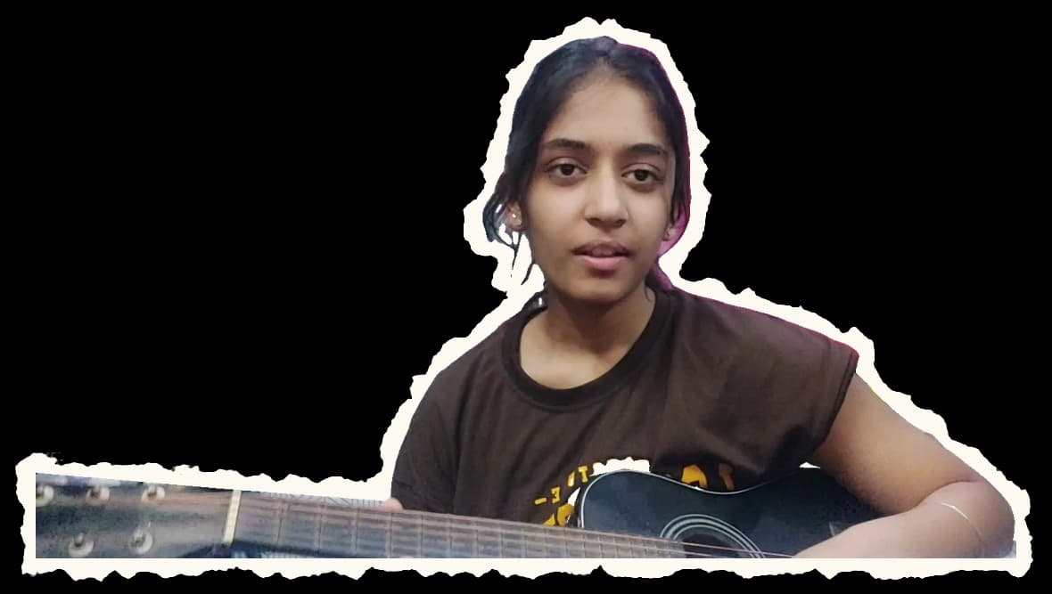 Khushi learning to play guitar