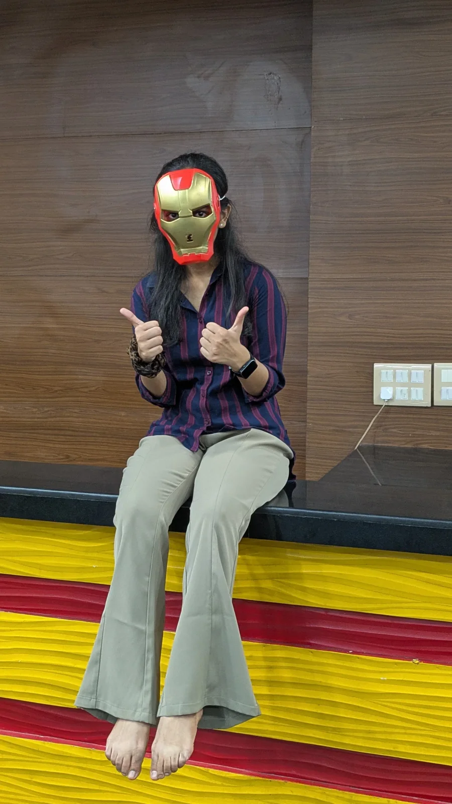 Khushi wearing an Iron Man mask