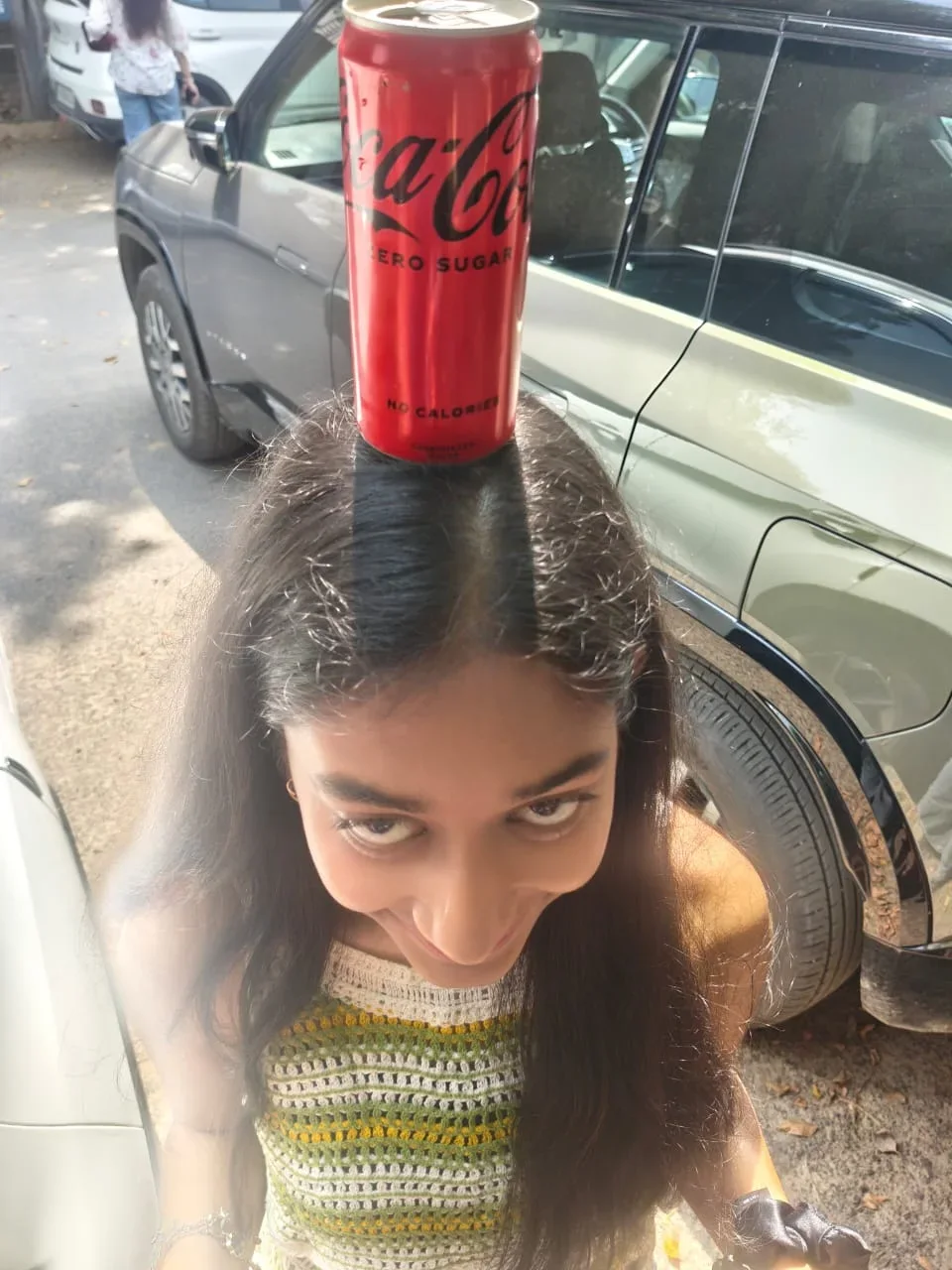 Balancing a Coke can for a playful photo
