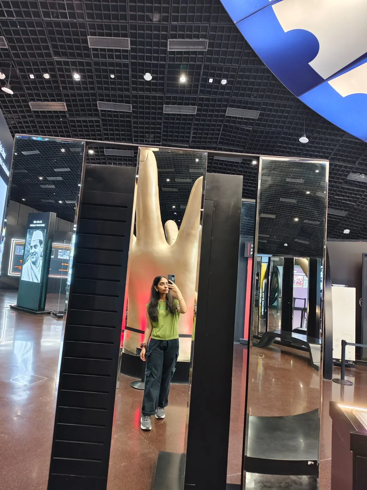 A mirror portrait at an exhibition