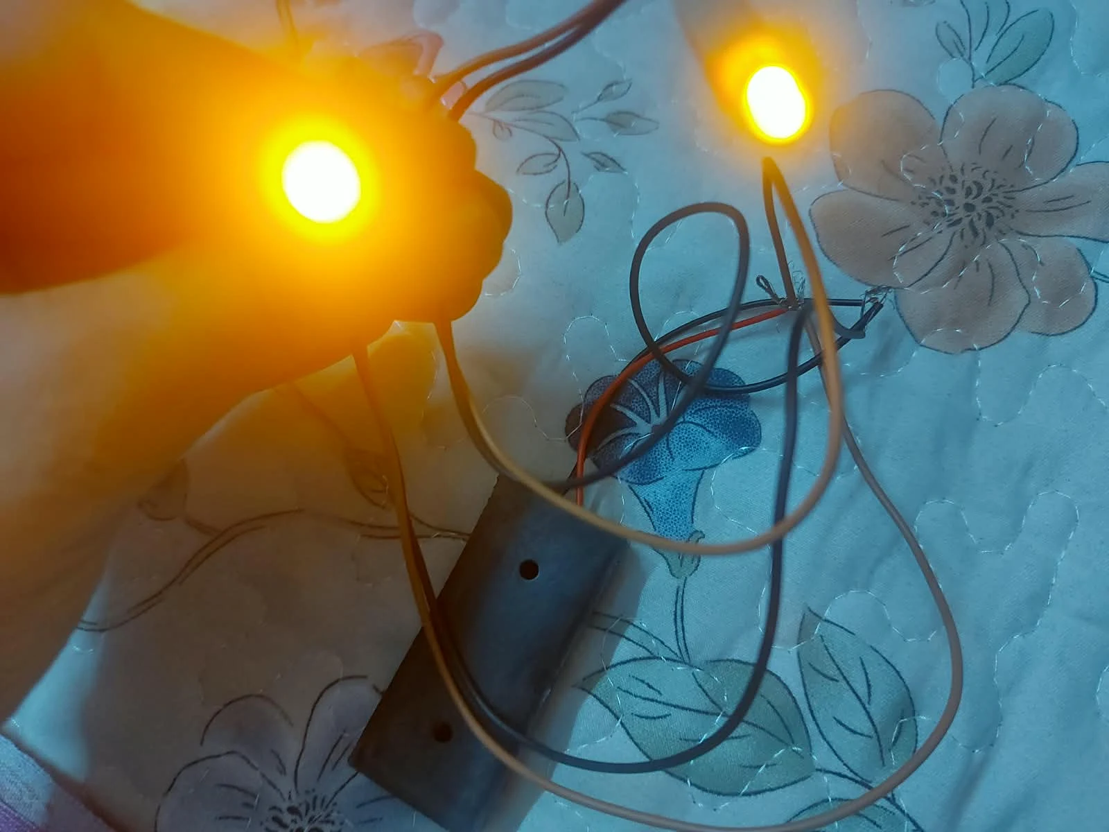 A small circuit with two glowing lights